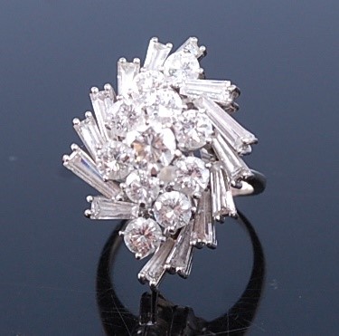 Lot 2357 - A white metal diamond cocktail ring, featuring...