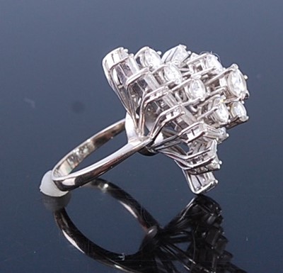 Lot 2357 - A white metal diamond cocktail ring, featuring...
