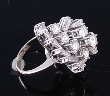 Lot 2357 - A white metal diamond cocktail ring, featuring...