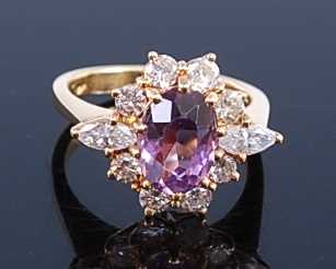 Lot 2358 - A yellow metal, amethyst and diamond oval...