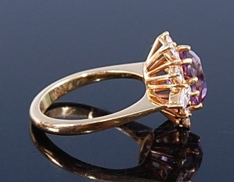 Lot 2358 - A yellow metal, amethyst and diamond oval...