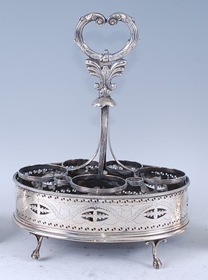 Lot 2069 - A George III silver cruet stand, of pierced...
