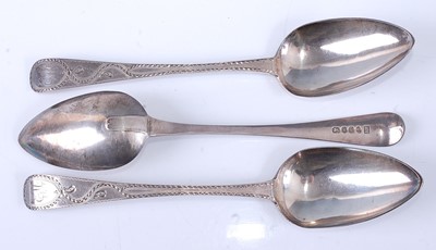 Lot 2177 - A set of three George III silver tablespoons,...