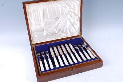 Lot 2185 - A 1930s fitted walnut canteen of cutlery,...
