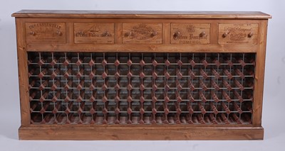 Lot 1542 - A large contemporary pine wine rack, the five...