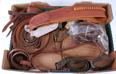 Lot 238 - A brown leather belt with with four ammunition...