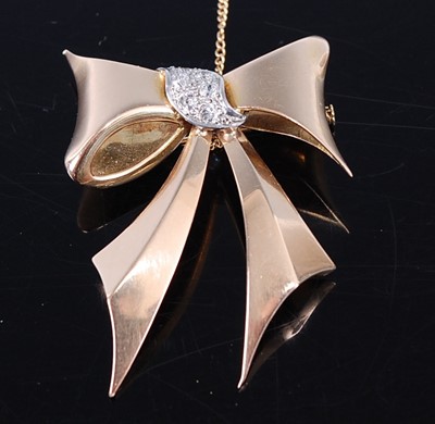Lot 2362 - A contemporary yellow metal diamond set ribbon...