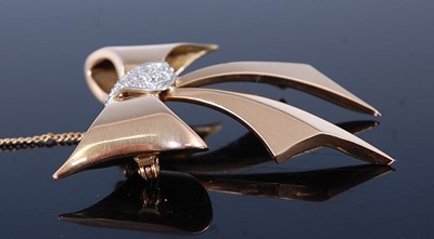 Lot 2362 - A contemporary yellow metal diamond set ribbon...
