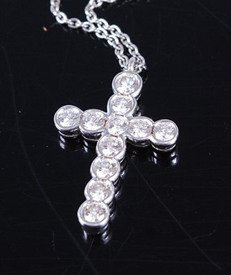Lot 2363 - An Asprey platinum diamond cross pendant, on...