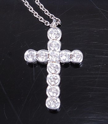 Lot 2363 - An Asprey platinum diamond cross pendant, on...