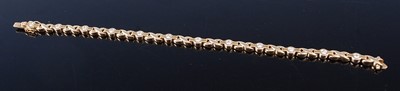 Lot 2354 - An 18ct yellow gold and diamond set multi-link...