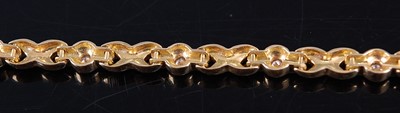 Lot 2354 - An 18ct yellow gold and diamond set multi-link...