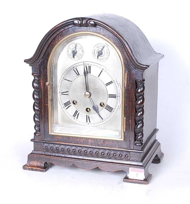 Lot 2 - An early 20th century oak cased mantel clock,...