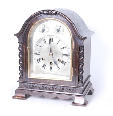 Lot 2 - An early 20th century oak cased mantel clock,...