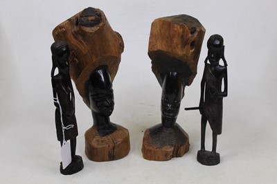 Lot 43 - A pair of African hardwood busts, each carved...