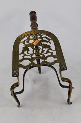 Lot 50 - A 19th century brass trivet, of lyre shape,...
