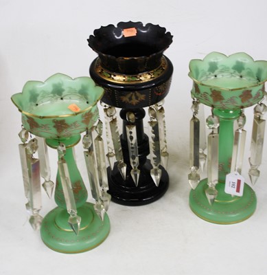 Lot 102 - A pair of early 20th century green glass table...