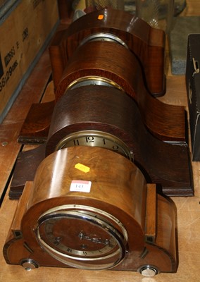 Lot 143 - A 1930s walnut cased mantel clock having a...
