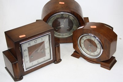 Lot 148 - A 1930s walnut cased mantel clock having a...