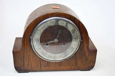 Lot 148 - A 1930s walnut cased mantel clock having a...
