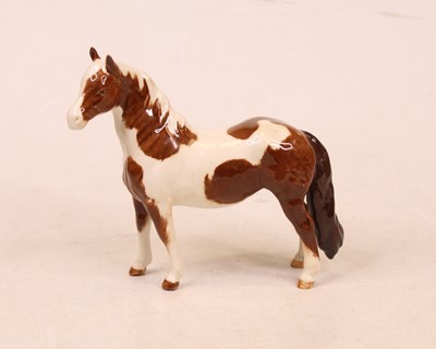 Lot 219 - A Beswick figure of a Pinto pony model No....