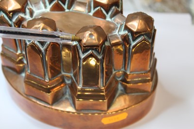 Lot 237 - A Victorian copper castle-top jelly mould,...