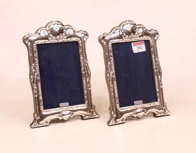 Lot 282 - A pair of modern silver clad easel photograph...