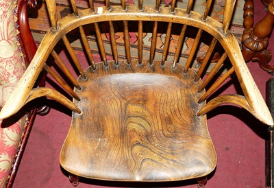 Lot 1402 - An elm and oak comb back Windsor chair, with...