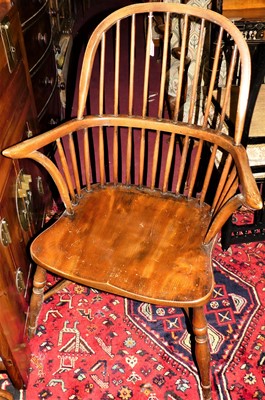 Lot 1404 - An elm and oak comb back Windsor chair, with...