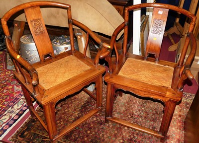 Lot 1419 - A pair of Chinese elm splatback elbow chairs,...