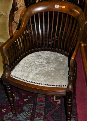 Lot 1413 - An Edwardian mahogany comb back tub armchair,...
