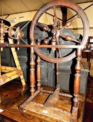 Lot 1437 - A fruitwood spinning wheel