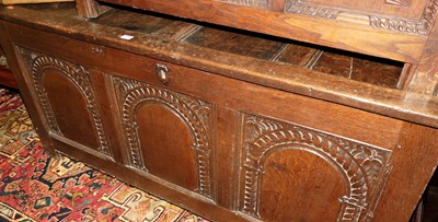 Lot 1439 - An 18th century joined oak three panelled...