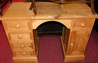 Lot 1477 - A modern pine kneehole desk having five...
