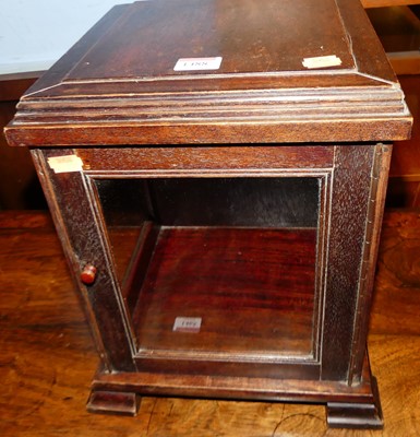 Lot 1488 - A small hardwood single door glazed table top...