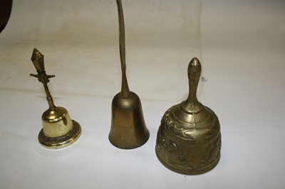 Lot 784 - A box of ornamental brass hand bells, to...