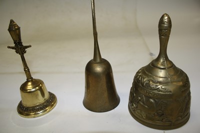 Lot 784 - A box of ornamental brass hand bells, to...