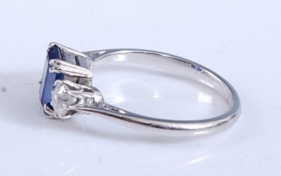 Lot 2165 - A white metal, sapphire and diamond three...