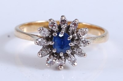 Lot 2167 - A yellow and white metal, sapphire and diamond...