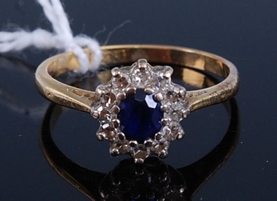 Lot 317 - A yellow and white metal, sapphire and diamond...