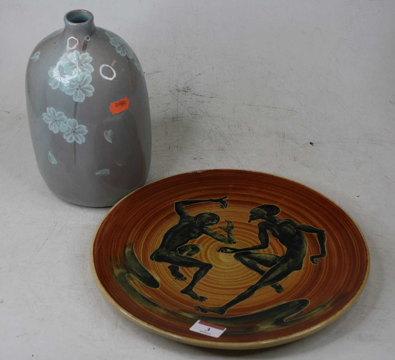 Lot 3 - A 20th century stoneware charger, decorated...