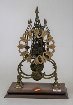 Lot 18 - A Victorian brass skeleton cathedral clock,...
