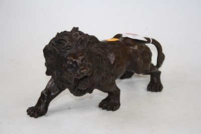 Lot 46 - A bronze model of a prowling lion, h.15cm