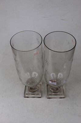 Lot 55 - A pair of contemporary glass hurricane lamps,...