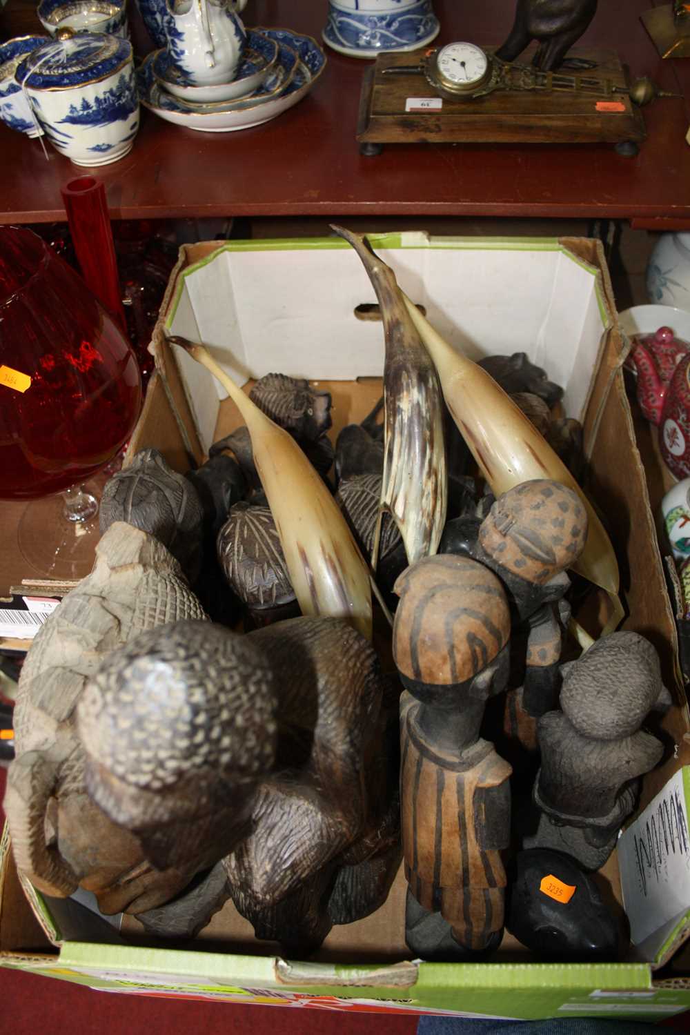 Lot 74 - A box of various African carvings to include...