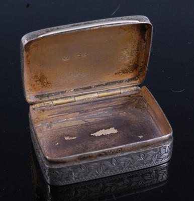 Lot 339 - A silver snuff box having bright cut leaf...