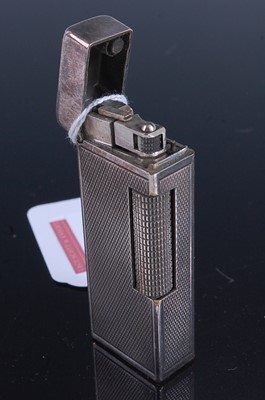 Lot 341 - A Dunhill engine turned steel pocket cigarette...