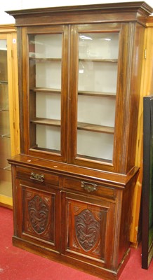 Lot 1103 - An Edwardian stained walnut and floral relief...