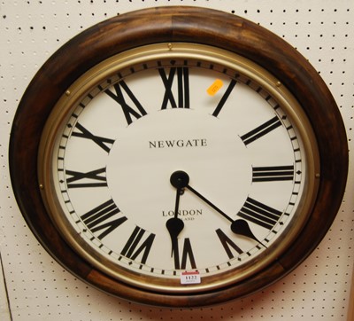 Lot 1122 - A contemporary circular wall clock, the dial...