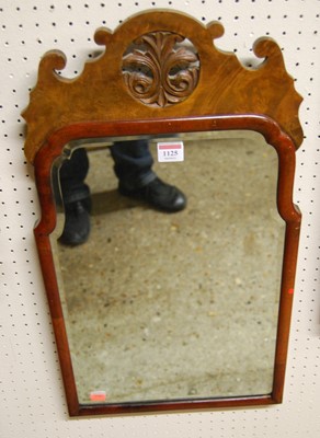 Lot 1125 - A walnut cushion framed and bevelled wall...